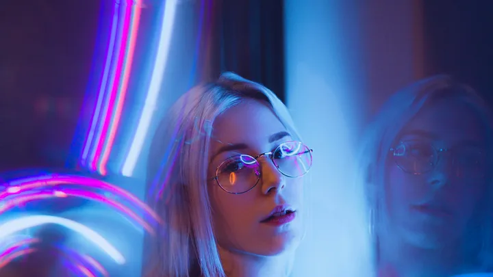 Woman in a neon-lit portrait taken in Auckland